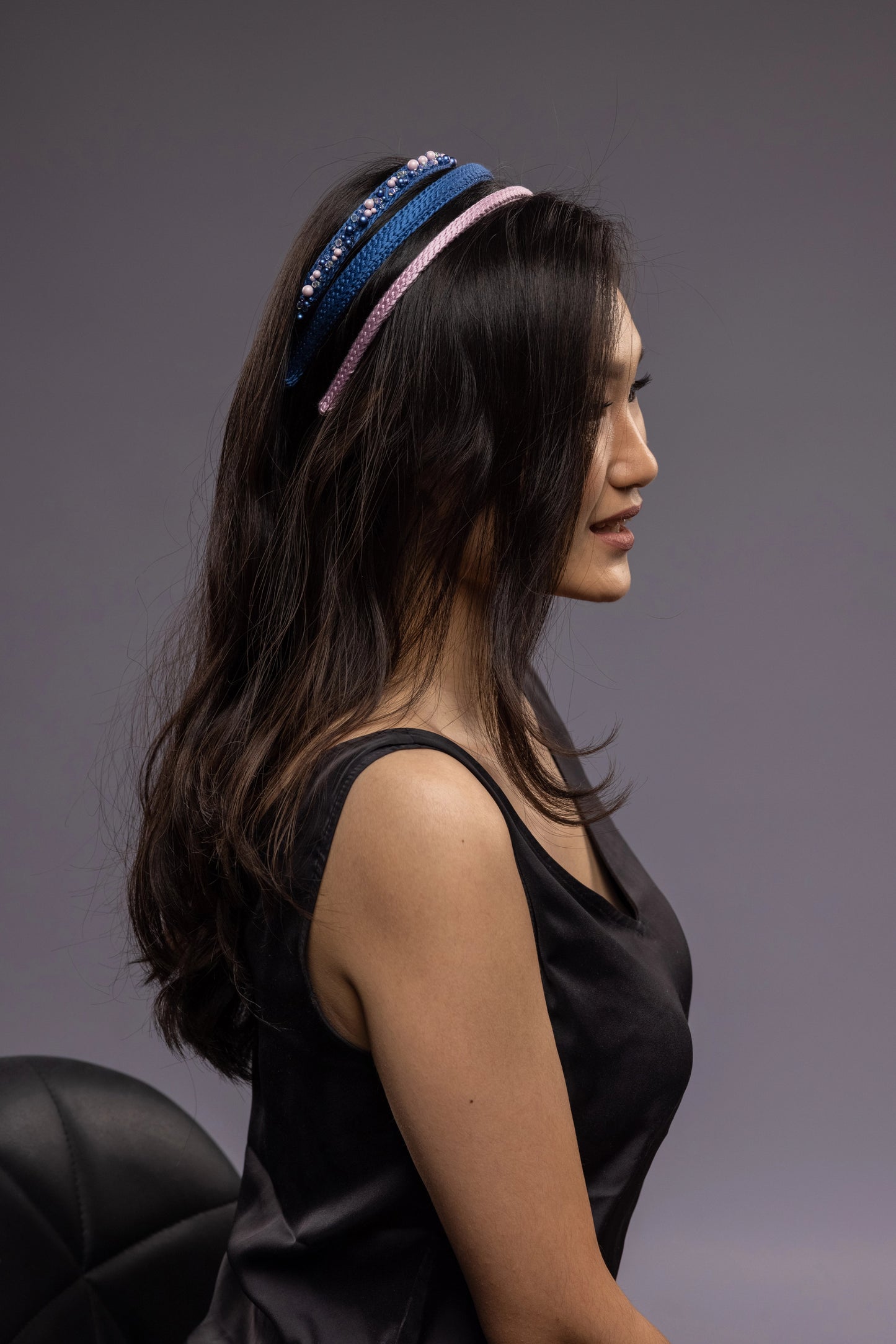 Asian beautiful girl is wearing three blue and pink Malkiele designer silk knit headbands