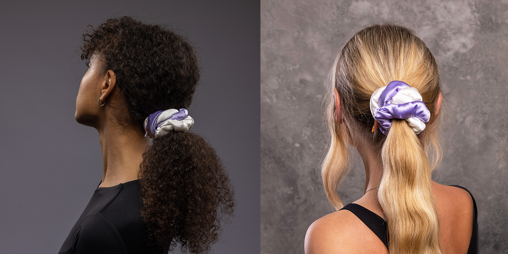 Two girls with stylish ponytails are wearing Malkiele designer silk scrunchies in white and lilac.