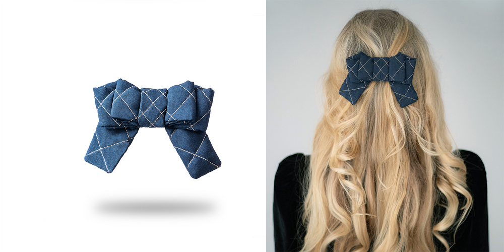 A blonde-haired girl with long hair is wearing Malkiele designer silk quilted bow in blue.