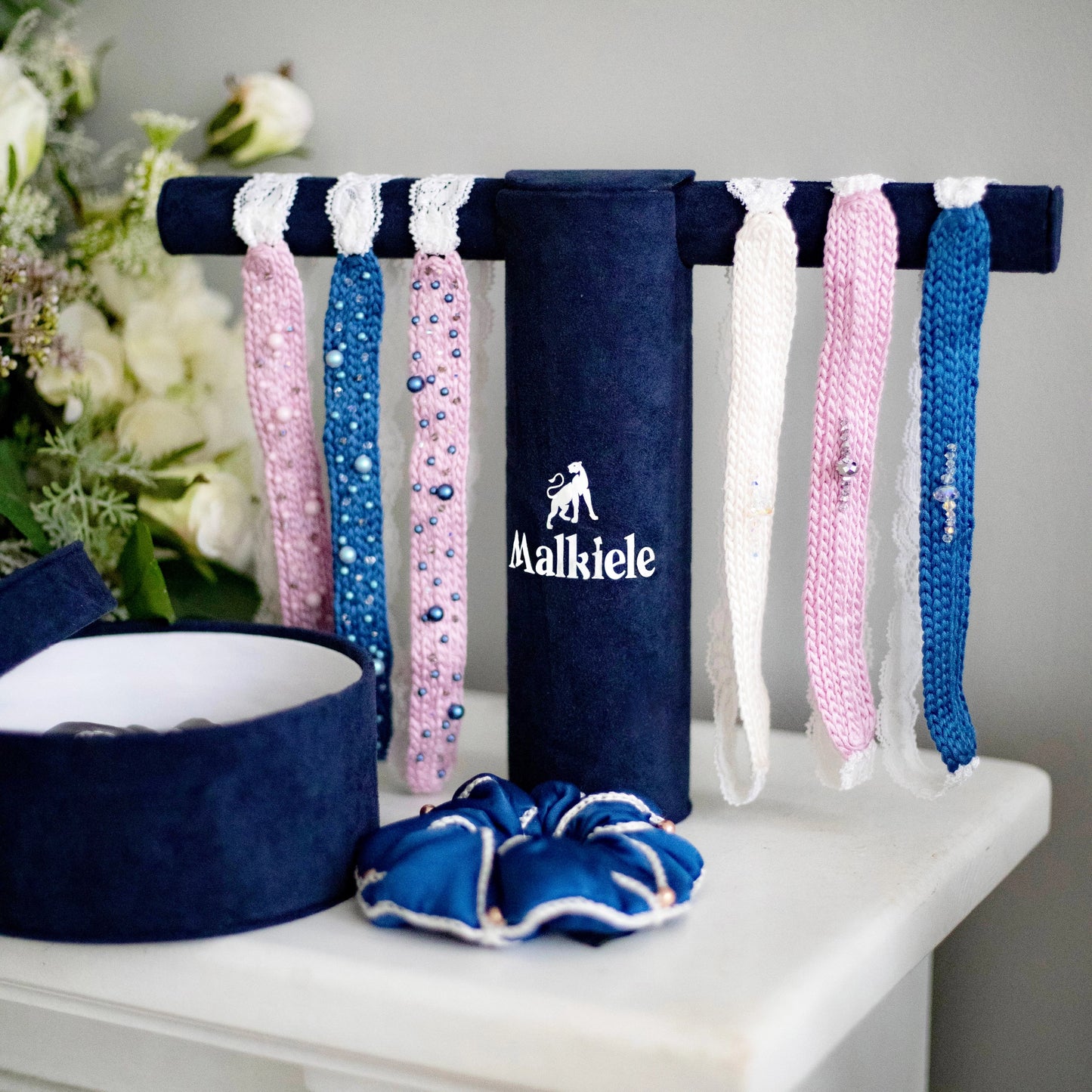 The set of six Malkiele designer silk knit headbands, embellished with pearls from Swarovski, white, blue and pink colors.