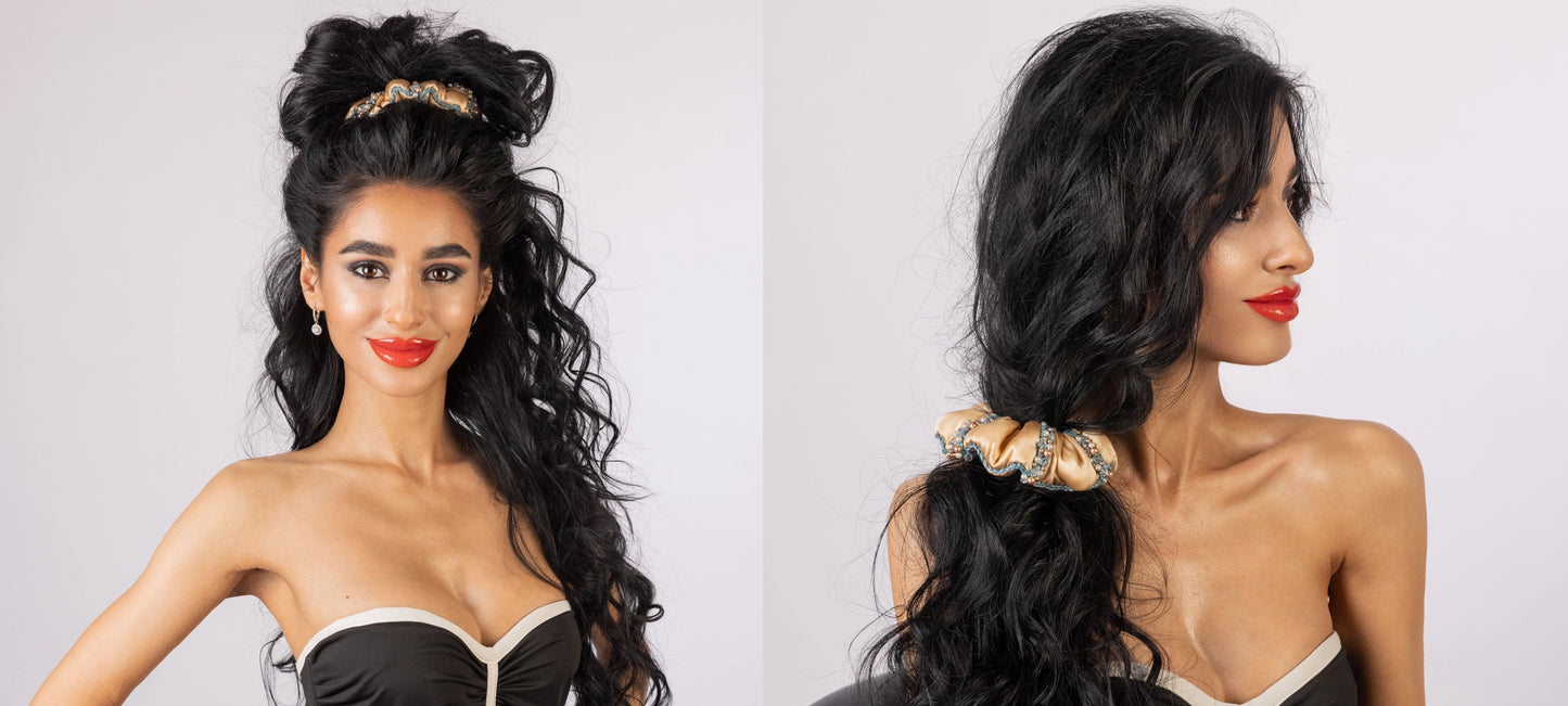 Set of two black-haired girls with stylish ponytails, the girls are wearing Malkiele designer beige silk scrunchies, embellished with Swarovski crystals.