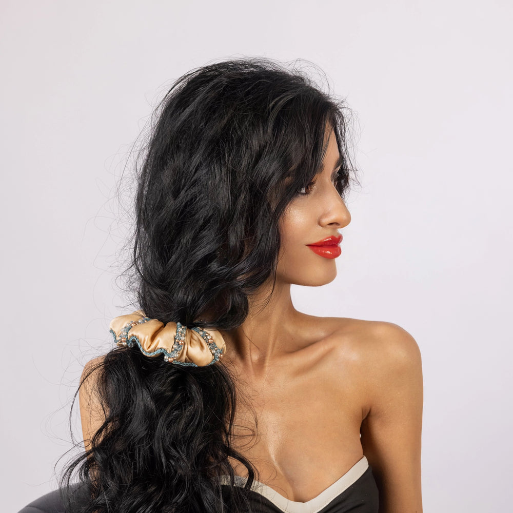 Stylish black hair girl is wearing Malkiele designer silk scrunchie Elizabeth embellished with pearls from Swarovski®.