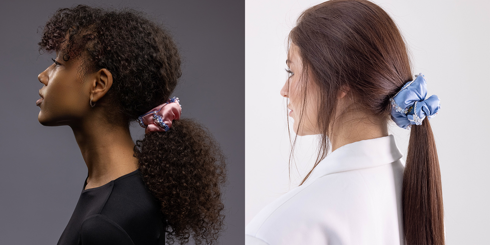 Two girls, side view, with stylish ponytails are wearing Malkiele designer silk scrunchies in pink and blue with Swarovski crystals.