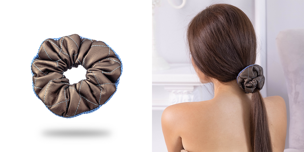 A dark-haired girl with trendy ponytail is wearing Malkiele designer vegan leather scrunchie in brown.