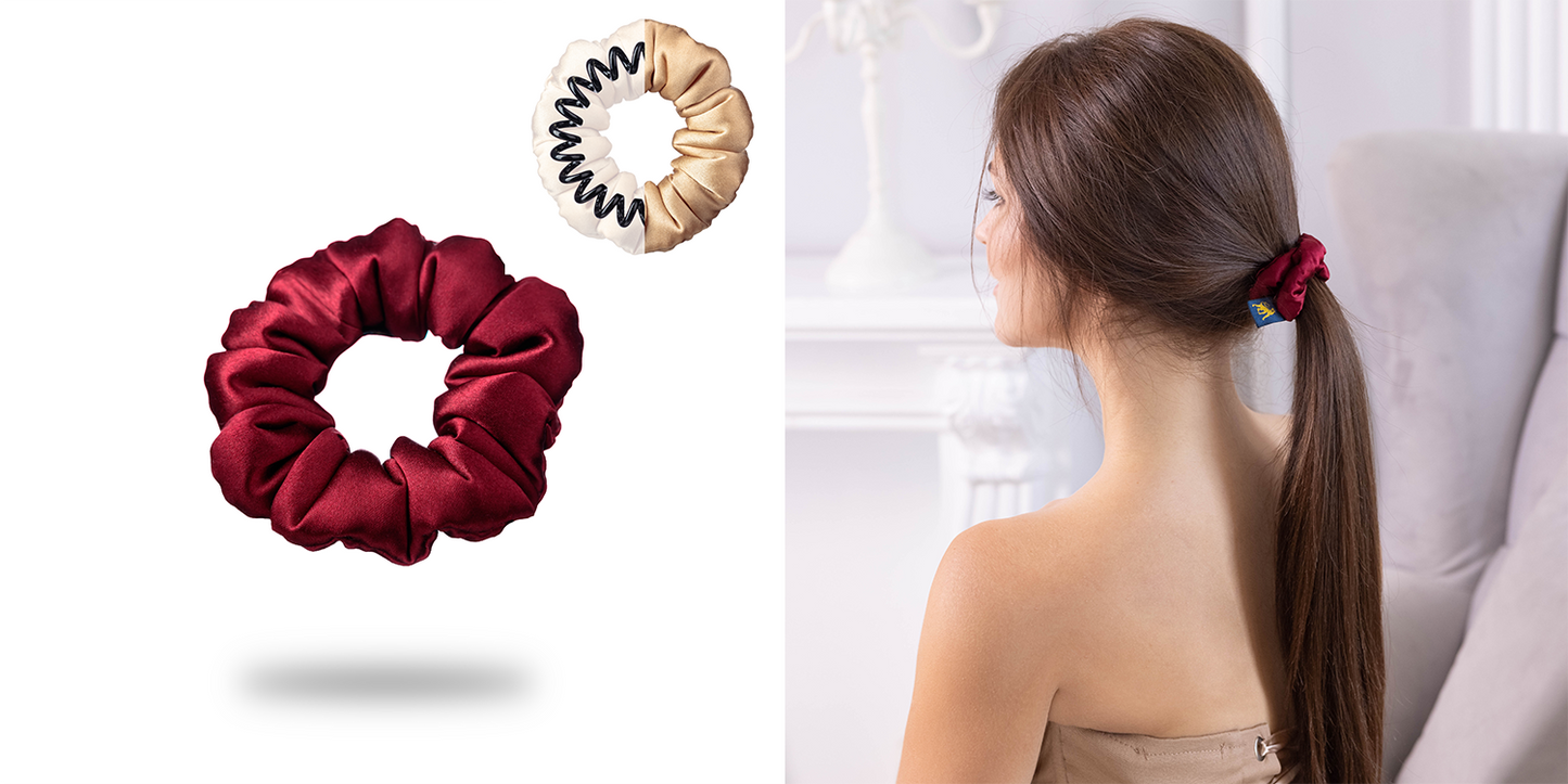 A dark-haired woman with classy ponytail is wearing Malkiele designer silk scrunchie in burgundy.