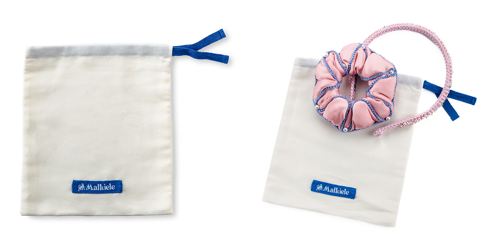 Malkiele size guide for Preferred double cotton dust bags, large size, one pink scrunchie and one pink headband are placed on the white dust bag.