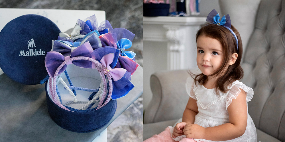 A dark-haired girl is wearing Malkiele designer silk headband with leather bow in light blue.