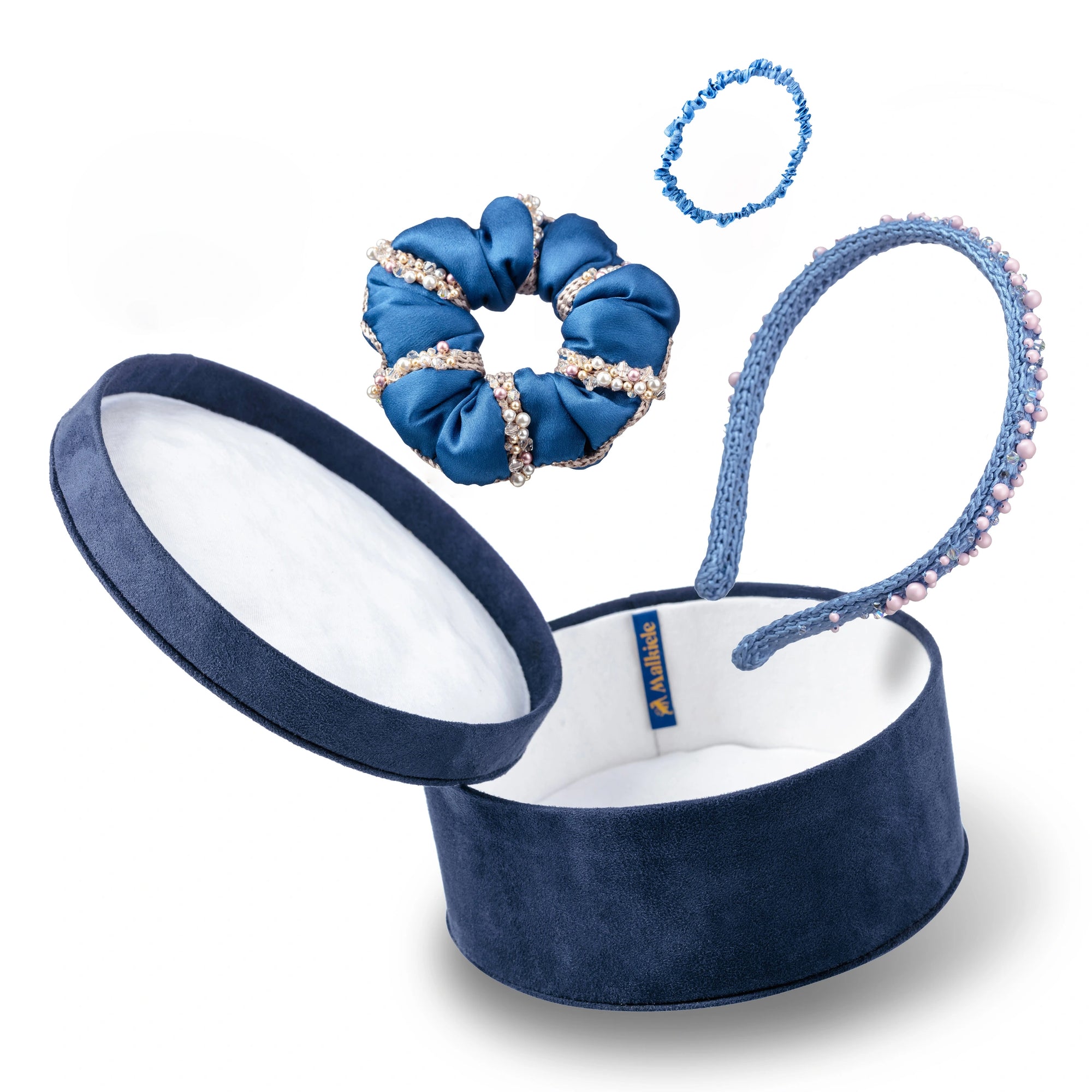 Malkiele designer gift set consists of blue velvet round box, silk hair tie, silk blue scrunchie and silk knit headband embellished with pearls from Swarovski®, in light blue color, name Precious.