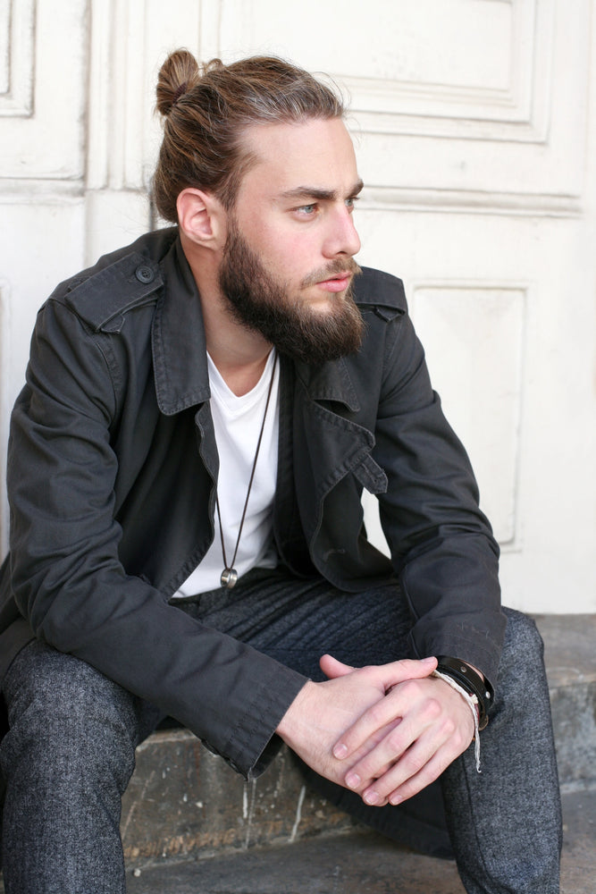 
                  
                    A man with a bun wears Malkiele silk hair tie
                  
                