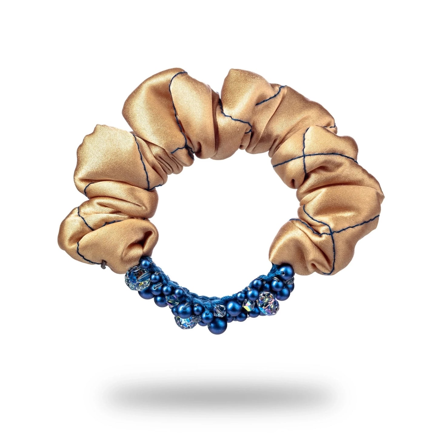 
                  
                    Malkiele designer, beige silk scrunchie for woman, embellished with blue pearls from Swarovski® and blue silk knit ribbon, premium and sustainable, name Glowing.
                  
                