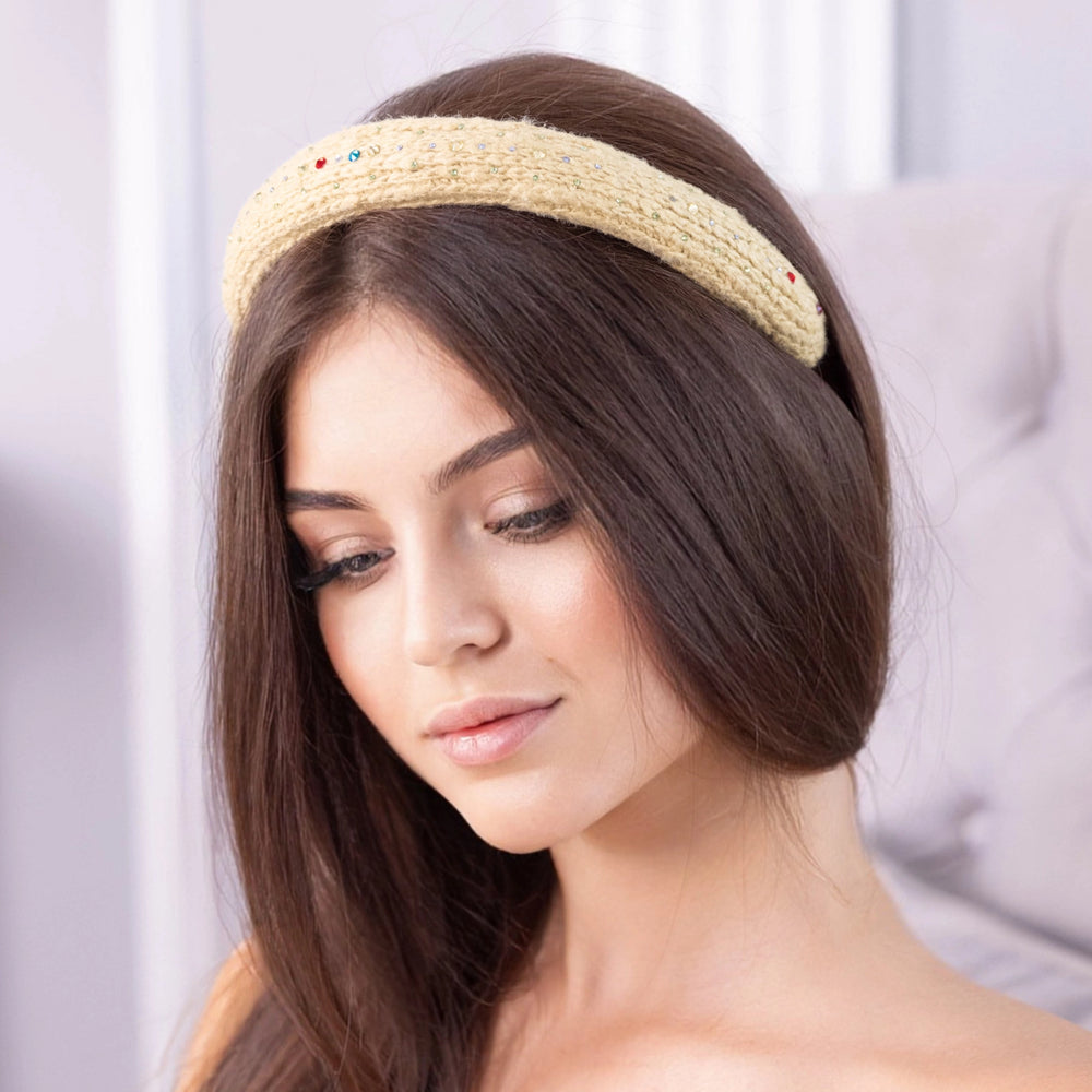 
                  
                    A dark-haired woman, is wearing Malkiele designer yellow silk knit headband, embellished with crystals from Swarovski, name Lofty.
                  
                