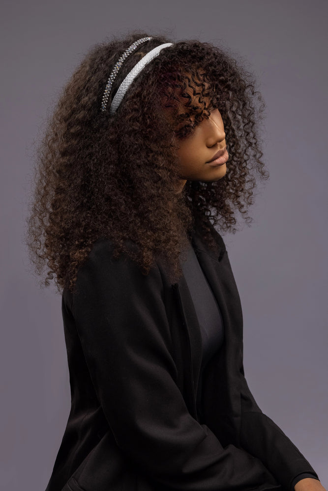 
                  
                    A dark-haired girl is wearing Malkiele designer grey silk knit headbands, one is embellished with light blue pearls from Swarovski, name Perfect.
                  
                