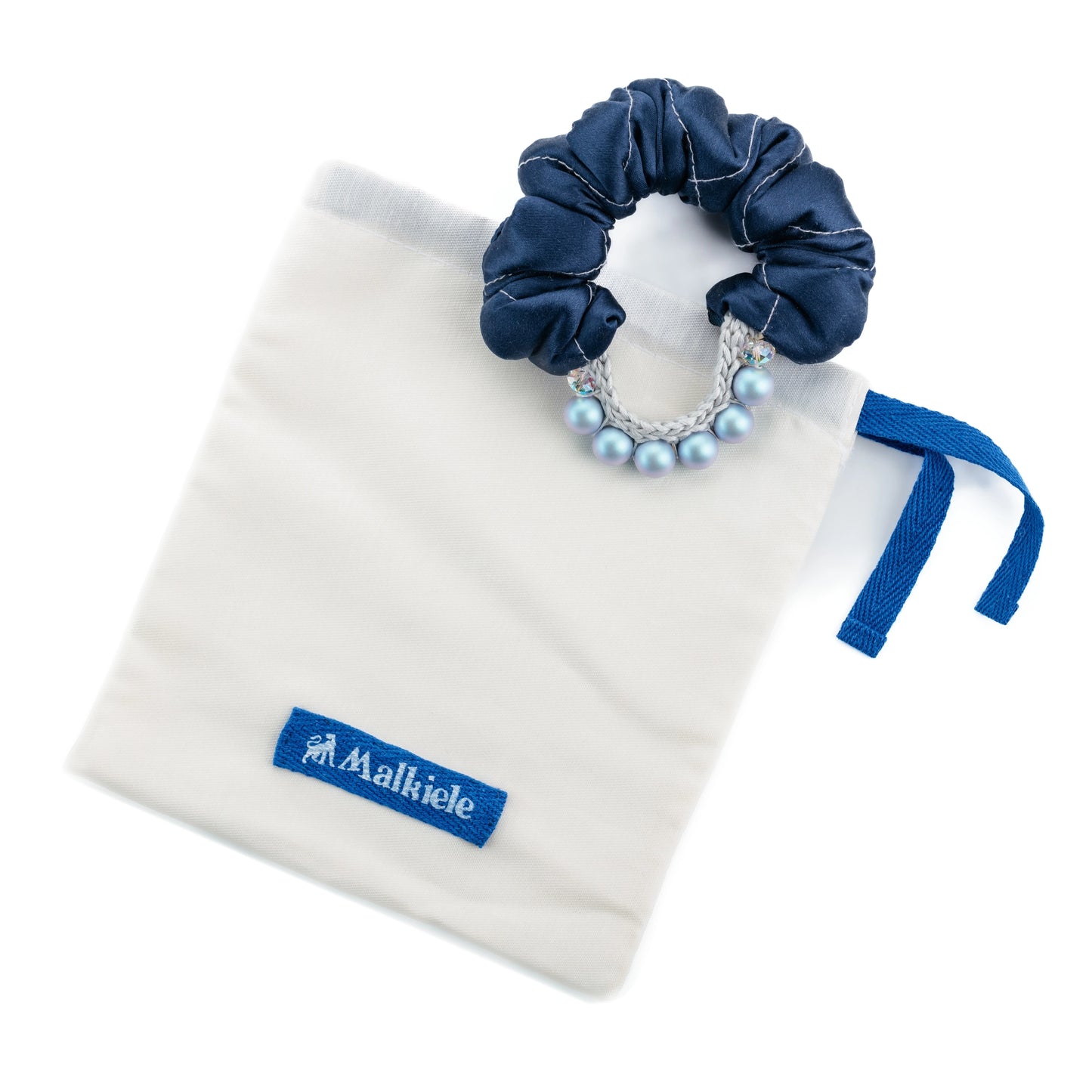 
                  
                    Malkiele designer, white double cotton dust bag, with blue logo and blue ribbon, medium size, silk blue scrunchie with pearls is on top, premium and sustainable, name Preferred.
                  
                