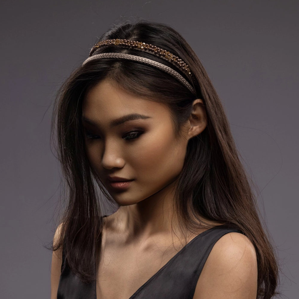 A dark-haired Asian girl is wearing Malkiele designer beige silk knit headbands, embellished with pearls from Swarovski, details, name Victorious.